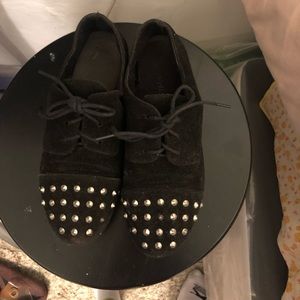Lightly worn black studded flats